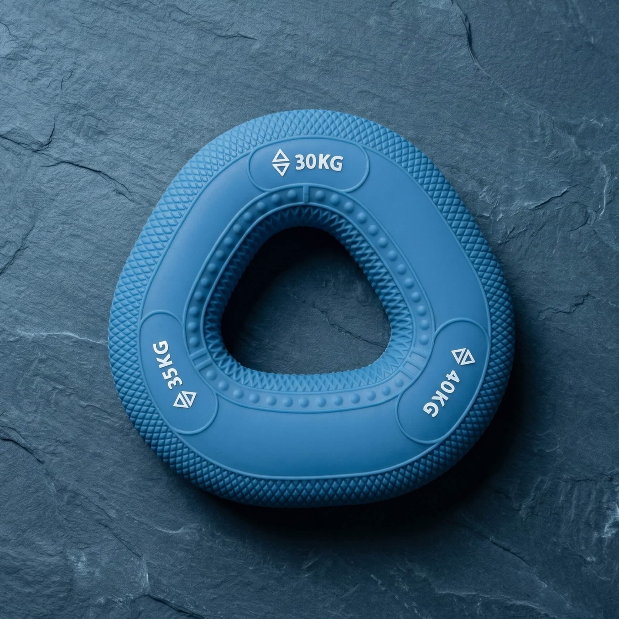 Cobalt blue grip ring, 30–40kg, on slate