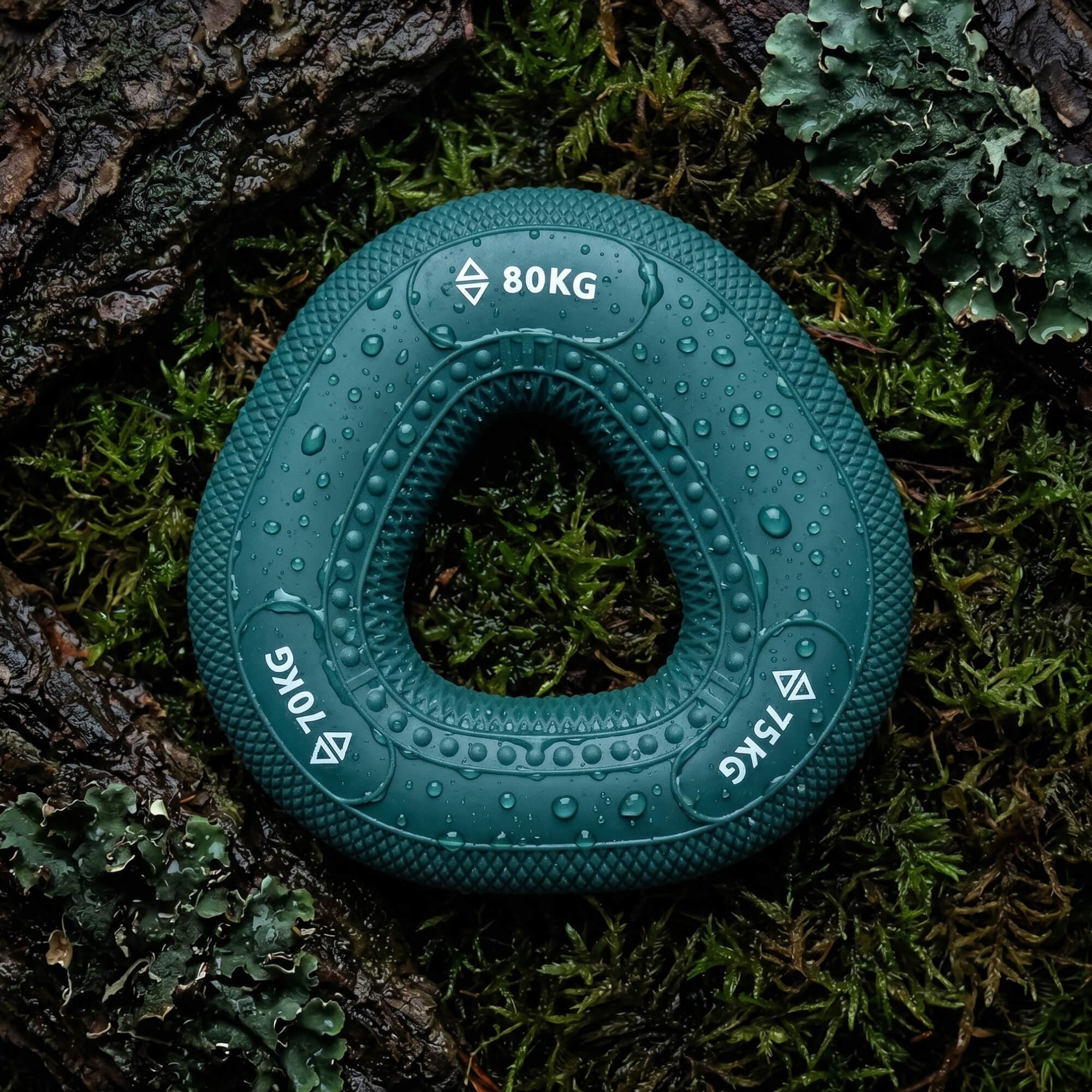 Phantom teal grip ring, 70–80kg, on mossy bark
